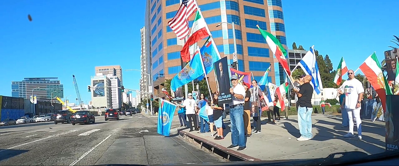 In the meantime, next to the federal building Westwood, California Persian flags, Israeli flags.