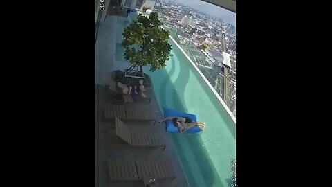 CCTV captures a 7.7 magnitude quake hitting Bangkok, sending swimmers in a rooftop pool running