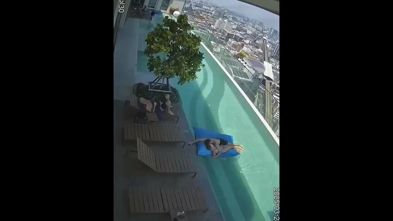 CCTV captures a 7.7 magnitude quake hitting Bangkok, sending swimmers in a rooftop pool running