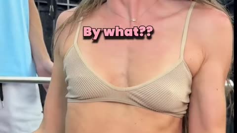 Girl lifting weights and her trainer 1