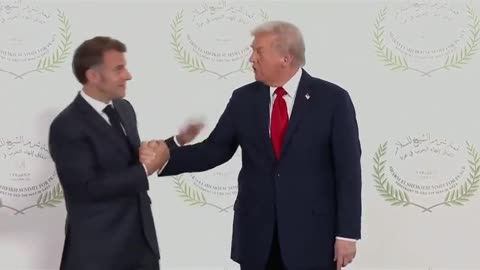 Trump engages in an arm-wrestling handshake with Macron at Gaza Summit