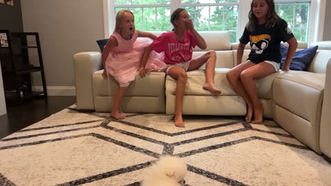 Sisters Surprised by New Puppy