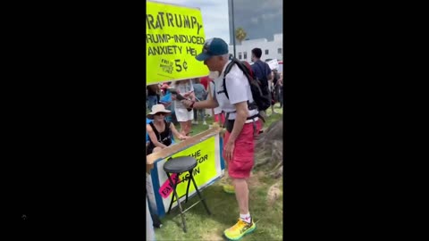 Grown adult seen beating a Trump doll to get his anger out at a ‘Theratrumpy’