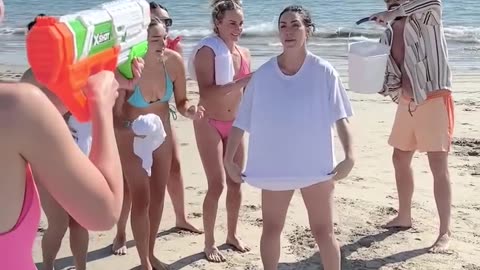 Gender reveal game using t-shirts and squirt gun.hd