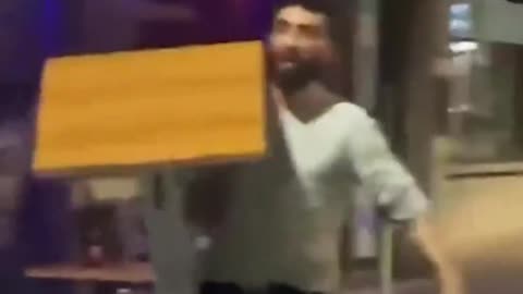 In Belgium, an antisocial refugee named Mohammed threatens a man with a machete...