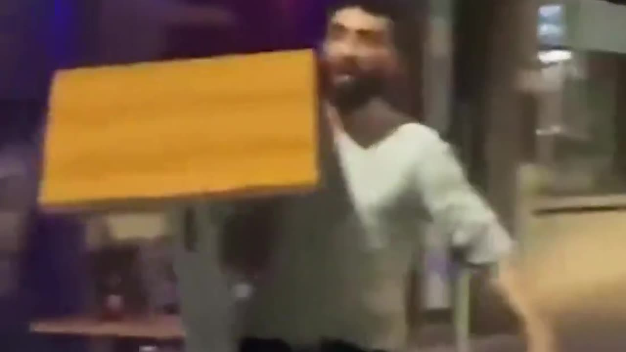 In Belgium, an antisocial refugee named Mohammed threatens a man with a machete...