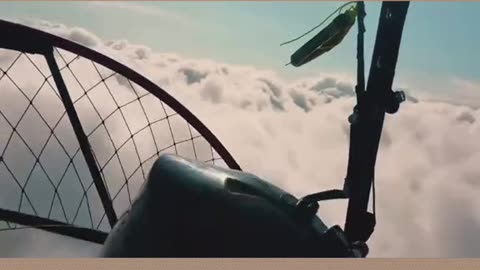 MAN STRAPPED TO A GIANT FAN WALKS ON CLOUDS