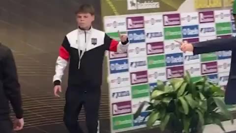 Young Ukrainian karate athlete walks off podium to avoid photo with Russian