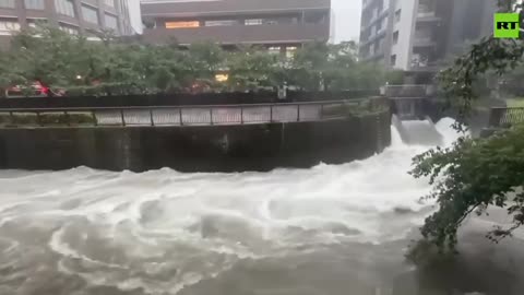 More footage shows torrents of water flooding the streets of Tokyo after heavy rain