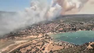 Aerial footage shows firefighting aircraft douse flames in Turkey