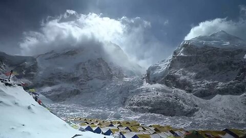 Hundreds scale Mount Everest in a weather-hit climbing season