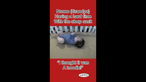 Grandpa wrestles sleep sack.