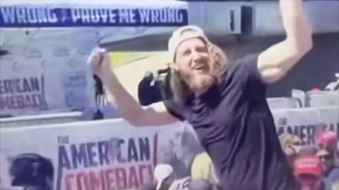 This guy seems awfully happy Kirk was shot. Is he signaling someone?
