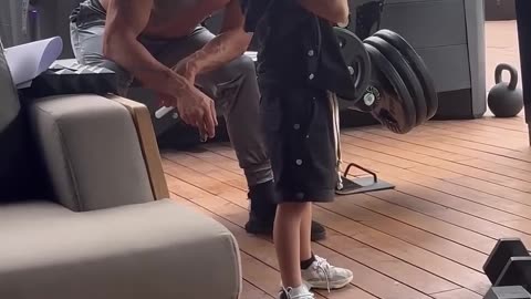 Andrew Tate training his son
