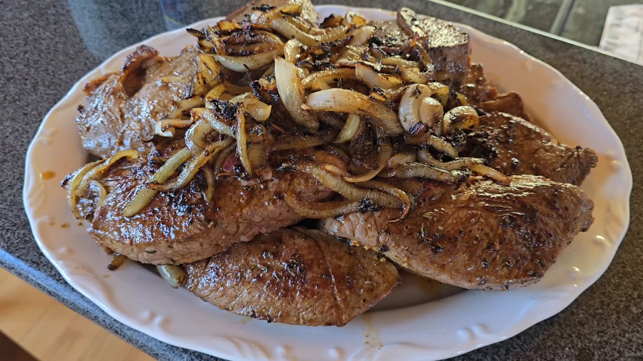 Steak, Potato and grilled onion dinner.