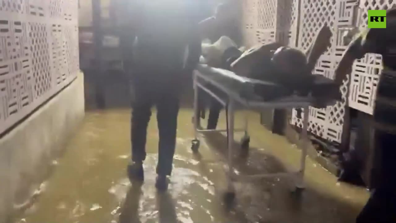 Patients wheeled through floodwaters at Delhi’s RML