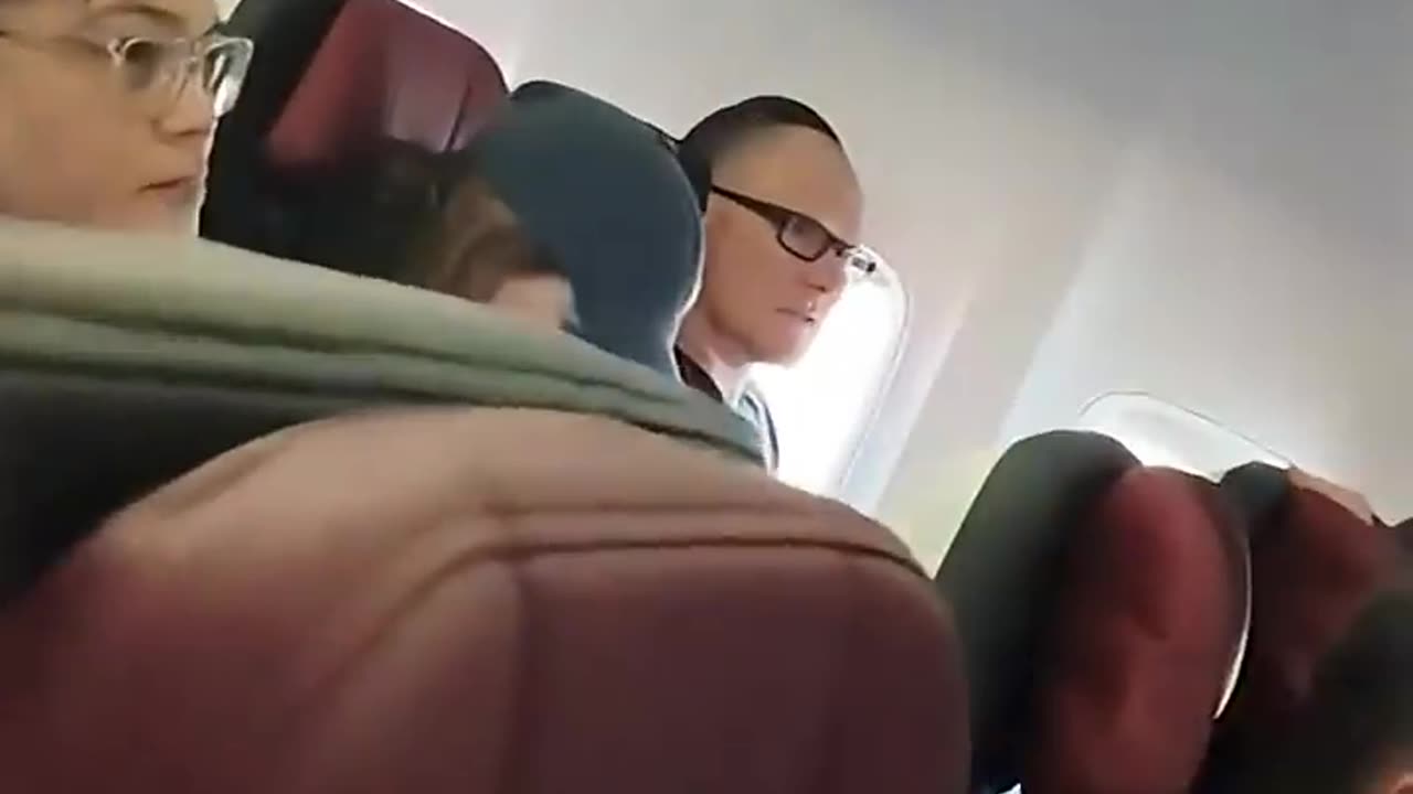 Woman arrested after abusing passengers and crew on a Virgin flight - 7NEWS Australia