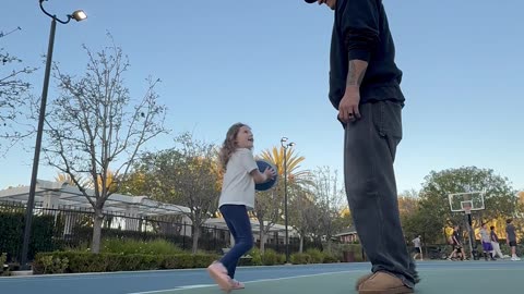 Dad Blocks Daughter's Theme Park Basketball Shot