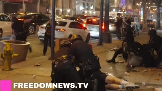 Police officers arrest looters in downtown LA