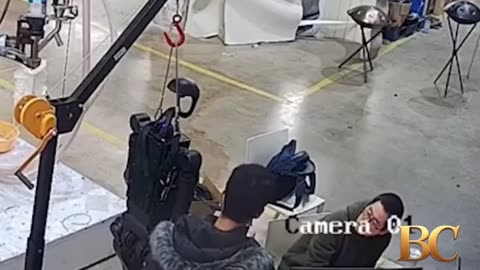 Haunting moment robot attacks handlers in angry rampage as it tries to break free from restraints