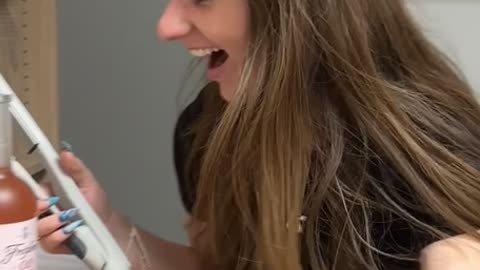 Using a Flat Iron to Uncork a Wine Bottle