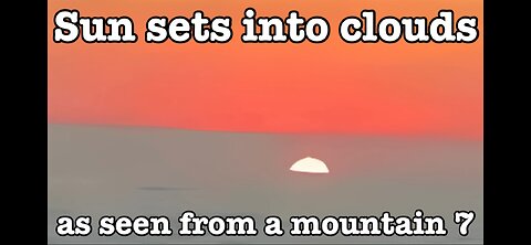 Sun sets into clouds as seen from a mountain 7