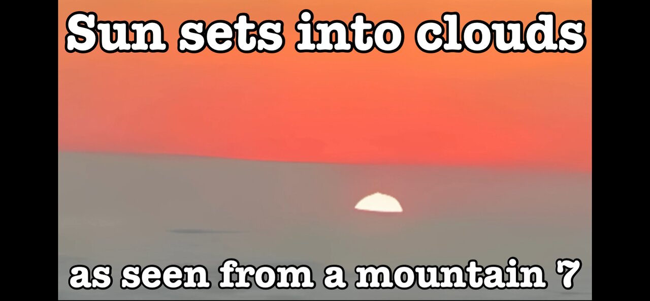 Sun sets into clouds as seen from a mountain 7