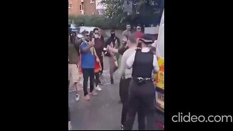 WHITE WOMAN POLICE CONSTABLE USES WHITE ARRESTEE AS HUMAN SHIELD AS MUSLIMS VIOLENTLY ATTACK HIM