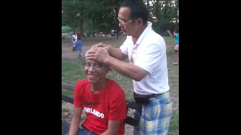Luodong Briefly Checks Energy And Massages Black Man On The Park Bench