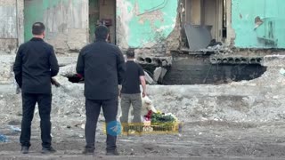 Zelenskyy Lays Flowers Near Building Where a Russian Missile Killed 28, Including 4 Children