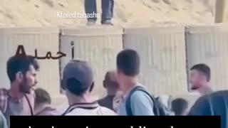 An American soldier shoots at people seeking help in the southern Gaza Strip.
