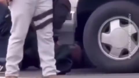 masked men wearing U.S. Border Patrol vests are seen violently detaining a Santa Ana father