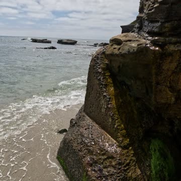 Cliff Rock Formation into Concrete along the shore San Diego #waves #ocean #coastal
