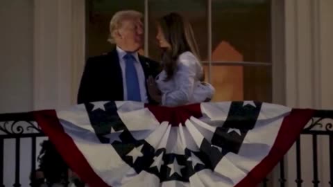 Trump pulls Melania in close for a kiss, while she physically tries to push him away.