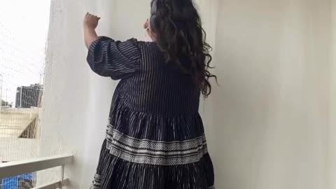 Woman Falls From Stool While Hanging Balcony Curtains