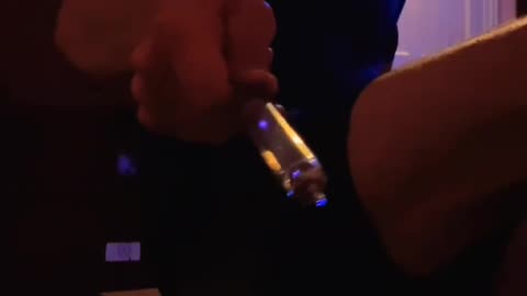 Powered syringe creating a corona discharge for lighting candles
