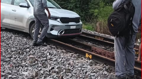 Shocking in Telangana: Woman Drives Car on Railway Track, Disrupts Trains – Video Goes Viral!