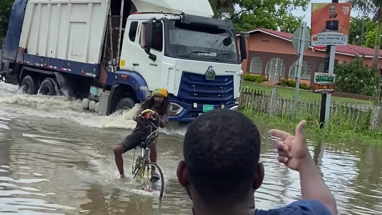 Jamaican Biker Feels The Water