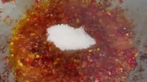 Girl cook river fish with country style