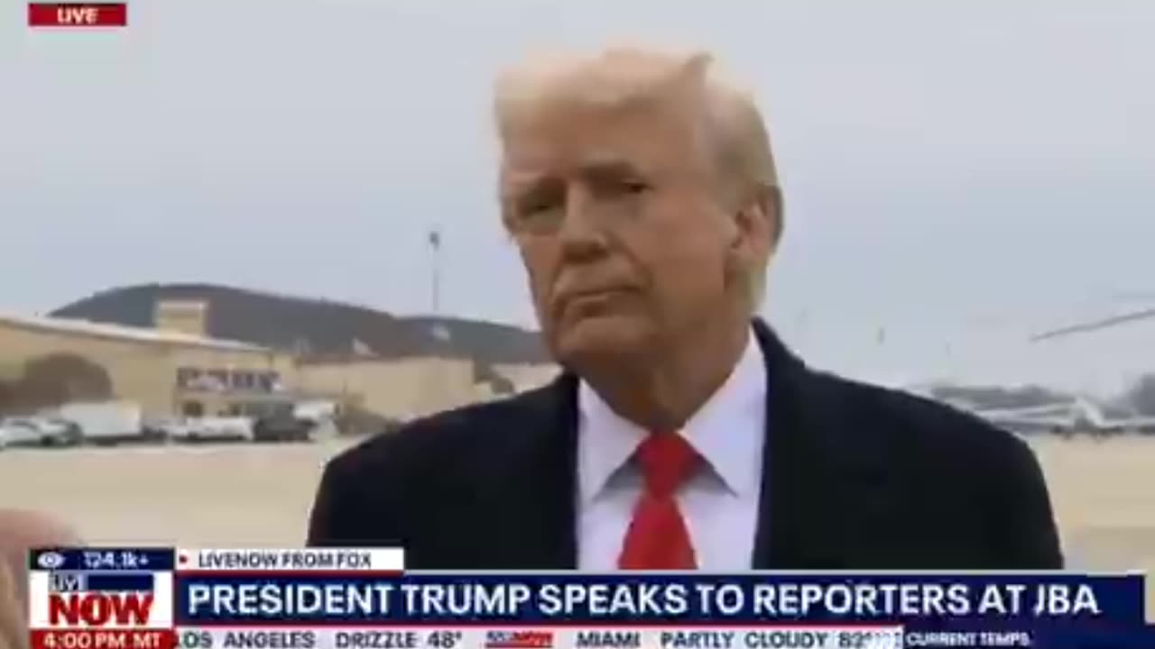 Reporter pushes microphone in Trump's face
