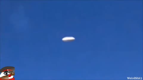 Bright elongated UFO releases orbs filmed by plane passenger