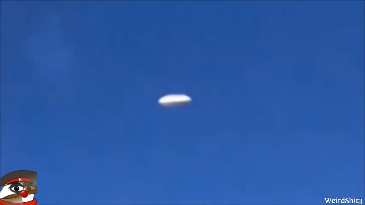 Bright elongated UFO releases orbs filmed by plane passenger