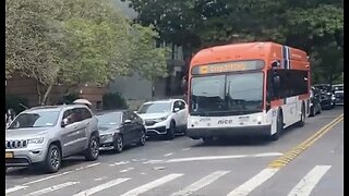 Gilig CityBus Nassau Inter-County Express Stopped in a Red Light