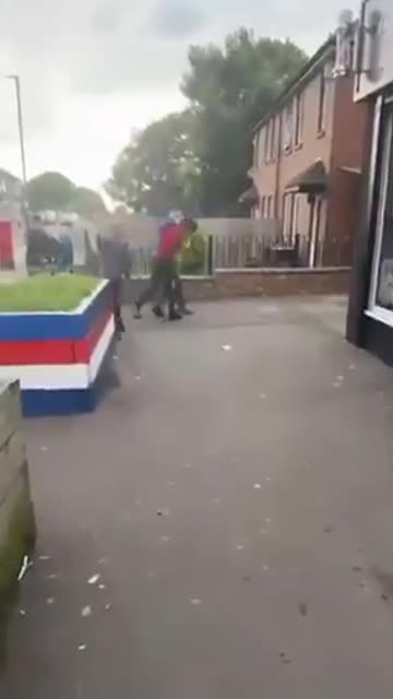 In England - a Man is attacked, when a load of young School Kids come to his aid.