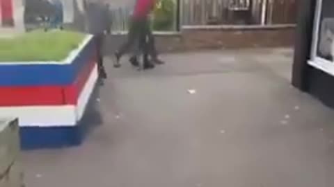 In England - a Man is attacked, when a load of young School Kids come to his aid.
