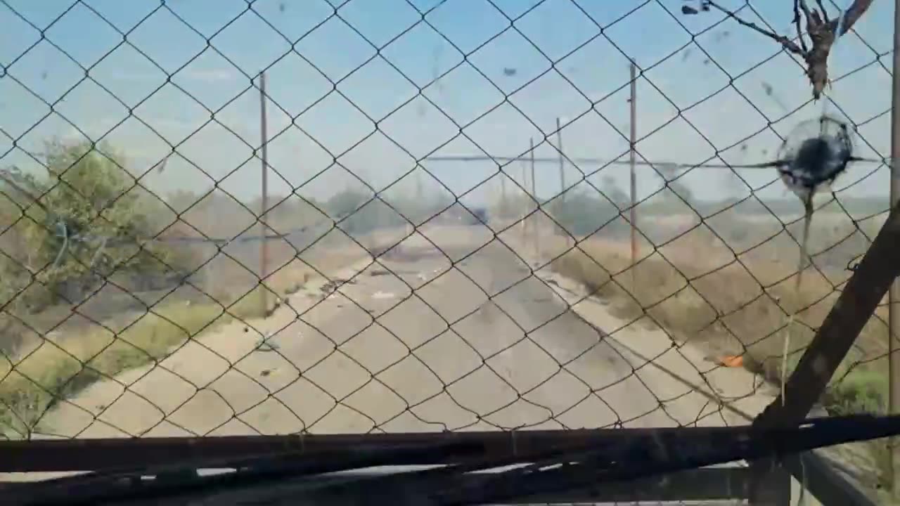 Russians Drive by Destroyed Grad LauncherThat Had Left Hours Ago