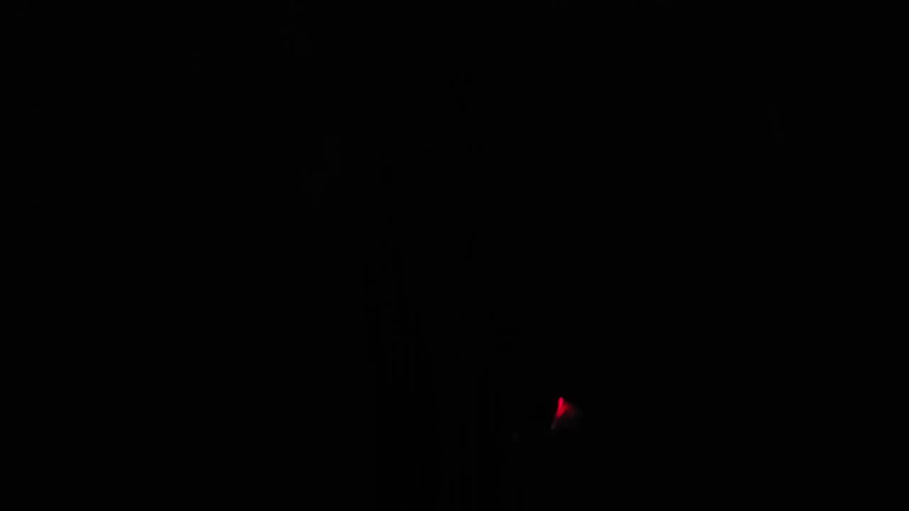 George and flashy ball at night