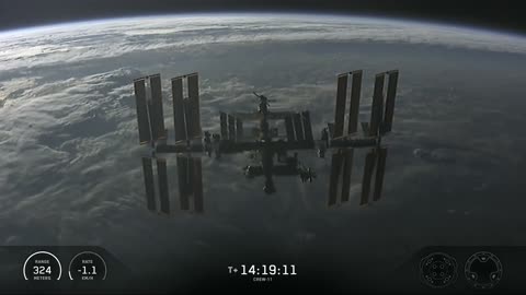 Dragon above the @Space_Station as it approaches for docking