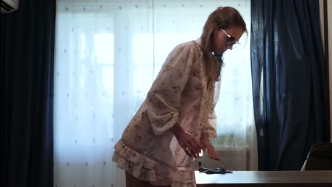 Transparent desk Cleaning with girlfriend in a dress