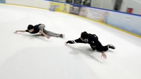 Ice Skating Show-Offs Knock Over Learner